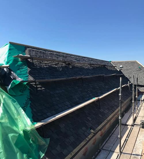 pitched roof being repaired